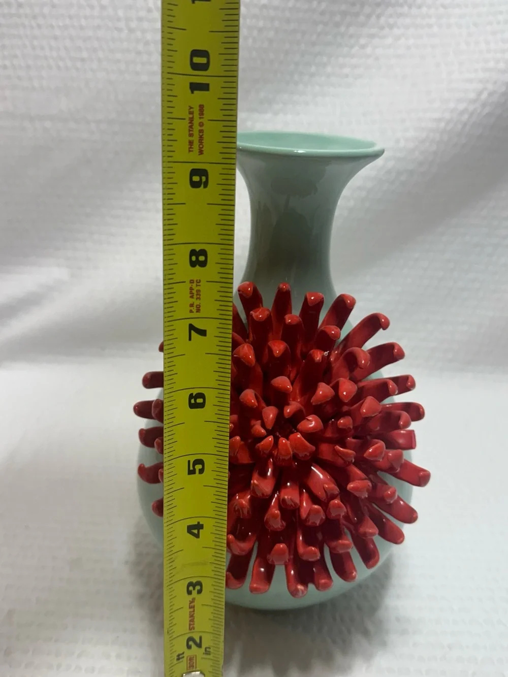 Anthropologie Ceramic Vase features a 3D red chrysanthemum bloom against a celad